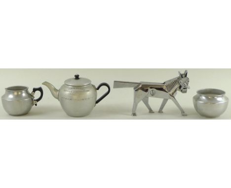 A Swan Brand aluminium teapot, 'Souvenir from the British Empire Exhibition London 1924' embossed on the side, 16.5 by 10.5cm