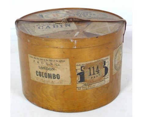 An early 20th century bentwood travel case hat box, of oval section  with leather strap and carry handle, various vintage tra