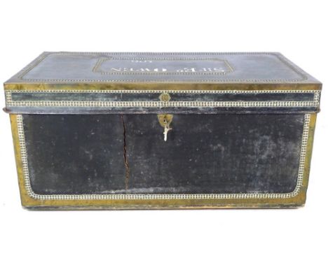 A late George III black leather travelling trunk, with brass bound and studded decoration, brass shield shaped escutcheon, th