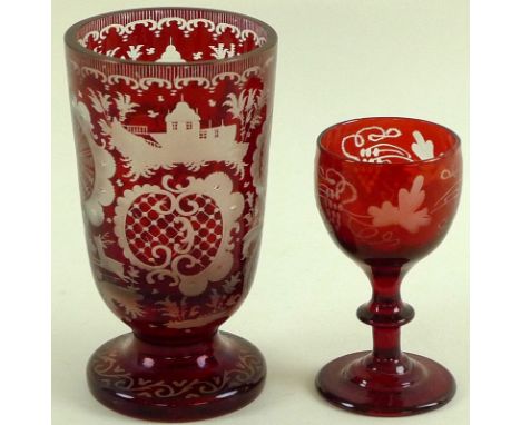A Bohemian ruby engraved goblet decorated with opposing C scrolls with cross hatching, a house and a deer, 12cm, together wit