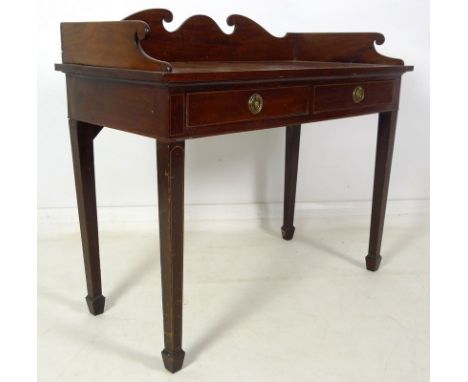 A Victorian mahogany side table, three quarter gallery with scroll end decoration, two frieze drawers with brass ring handles