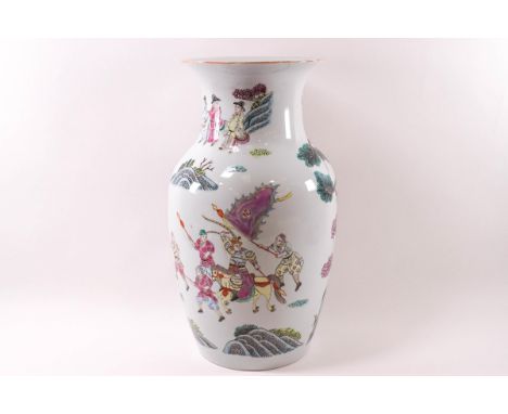 An early 20th century Chinese porcelain Canton enamel vase, painted with figures in an interior and a warrior with his soldie