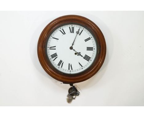 A 20th century mahogany and oak wall clock with painted 12" dial, key and pendulum