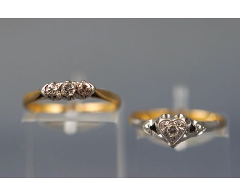 An 18ct & platinum three stone diamond ring (Size M1/2 - 2.0 grams) and an 18ct and platinum single stone diamond ring (Size 