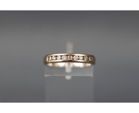 A white gold ring set with nine round brilliant diamonds. Shank stamped DIA. Hallmarked 18ct gold. Size M. 3.6 grams