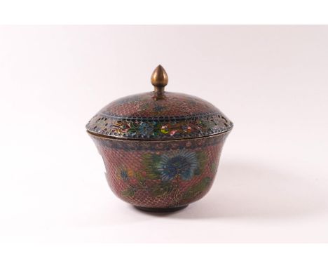 A Chinese plique de jour enamel pot pourri bowl and cover, decorated all over with blue flowers on a pink ground, 12.5cm high