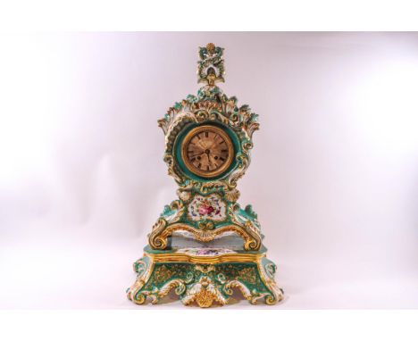 A large porcelain Salon clock with green and profuse floral decoration all around, 8 day movement, striking half and full hou