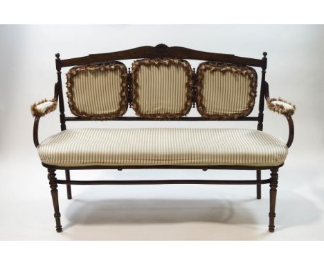 A Victorian mahogany and bentwood three piece salon suite with carved shell and scroll crest rails, re-upholstered, sofa 150c