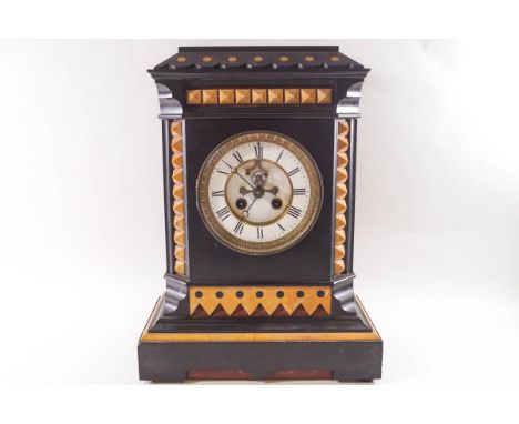 A Victorian black slate eight day mantel clock with visible escapement, 41cm high