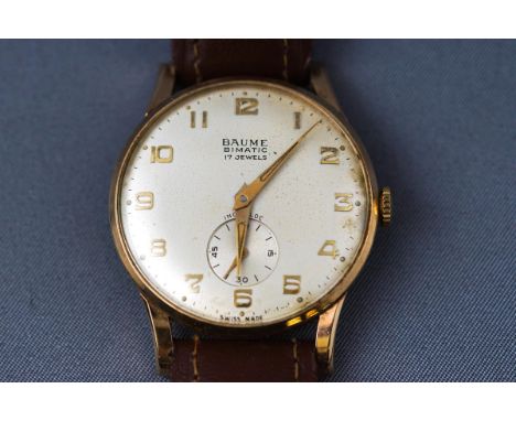 A Gentleman's wristwatch by Baume. Yellow gold case with champagne dial having an additional second hand. Dial signed Baume B