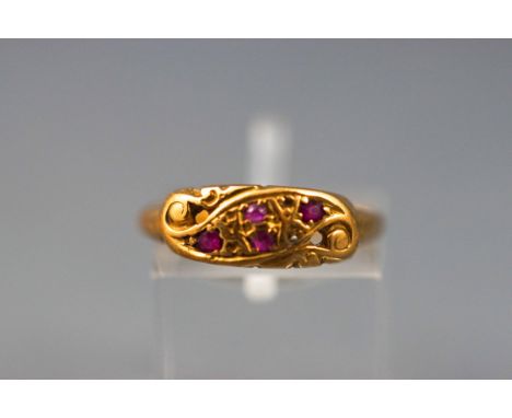 A yellow gold ruby and diamond crossover dress ring (some diamonds missing). Yellow shank, stamped 18ct. Size: L 1/2. 2.7 gra