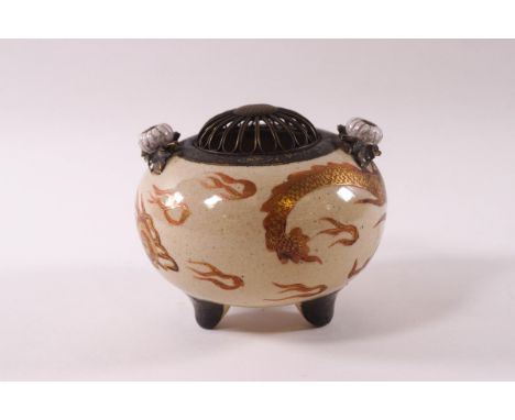 A Japanese earthenware Koro and metal cover, painted with a dragon in orange enamel and gilding on a neutral ground, 9cm high