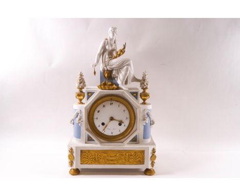 A 19th century French porcelain and ormolu mantel clock, the eight day movement striking on a bell, the painted dial signed G