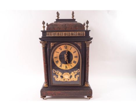 A 19th century French boulle mantel clock, the eight day movement striking on a gong, visible escapement from the sides, the 