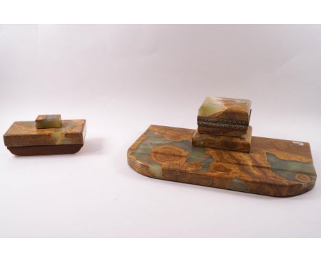 An early 20th century marble desk stand, 29cm wide, the inkwell with brass mounts and ceramic liner, together with matching b