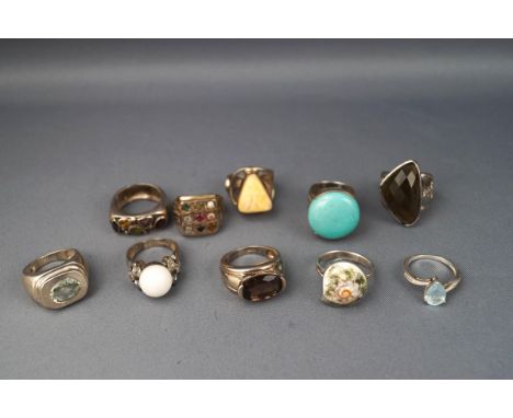 A selection of ten dress rings to include quartz, turquoise, honey amber and topaz stones. All stamped 925 for silver. Size r