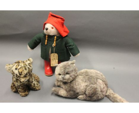 A vintage Paddington Bear soft toy together with two other soft toys of cats 