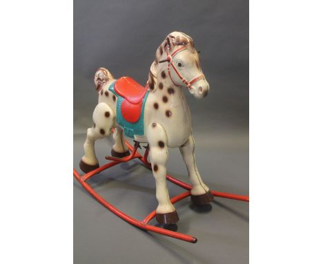 A vintage metal rocking horse