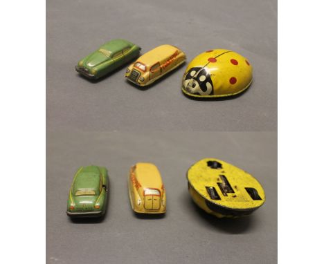 3 tinplate toys: A green clockwork tinplate saloon car with "Made in US zone Germany" to back, a transport van with "Germany"