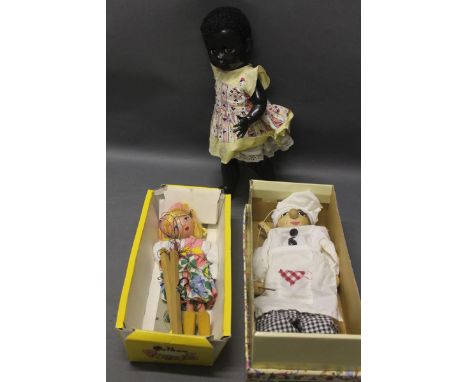 A vintage black Pedigree walker doll, a Pelham puppet & chef string puppet 