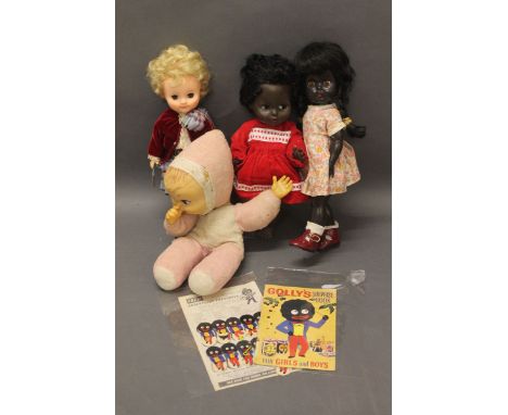 A 1970's vinyl Rosebud doll in Scottish dress, a vintage Suckathumb pink baby doll, a 1960's/70's Palitoy black doll, a 1950'