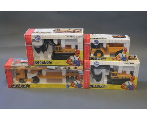 4 boxed Joal Compact model construction vehicles: Lowbed trailer DAF 95XF, Dump Truck 712, Excavator EC650 (x2) 
