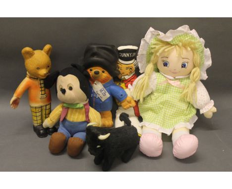 A 1974 Paddington bear bendy toy, a rubber Rupert the Bear toy, a 1950's Applause plush Mickey Mouse, a clockwork bull with s