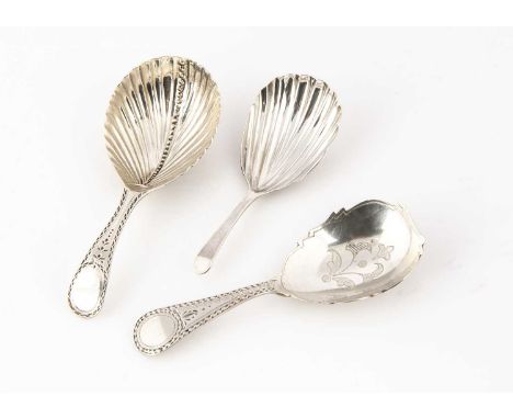 Three early 19th century period silver tea caddy spoons, two George III with shell shaped bowls, the other George IV with sha