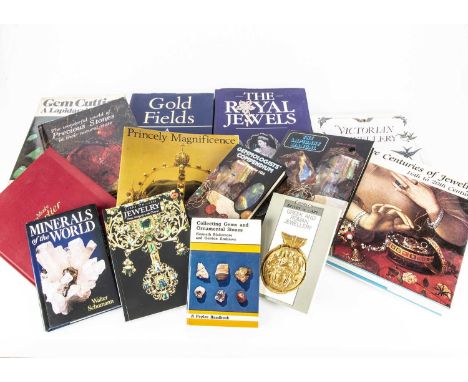 A collection of books on jewellery and jewellery making, including Gold Fields by Paul Johnson, Musee Cartier at Goldsmiths' 