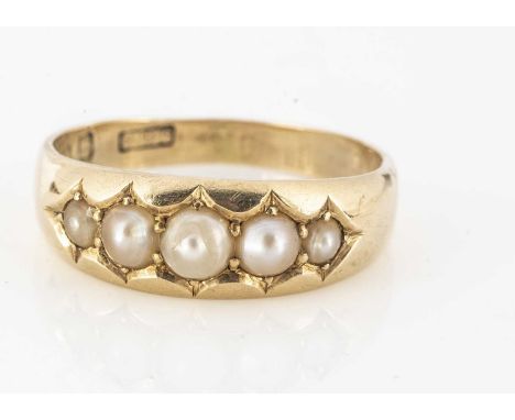 A Victorian 18ct gold Scottish freshwater pearl five stone ring, the band of half cut pearls in a shaped setting, ring size R