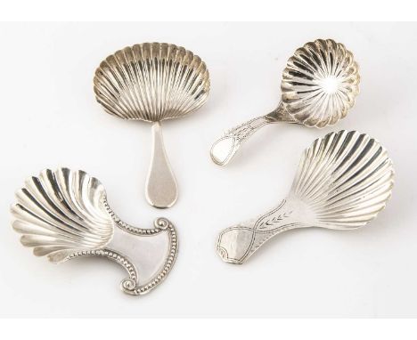 Four Georgian period silver tea caddy spoons, each with shell shaped bowl, one possibly reproduction and repaired (4)