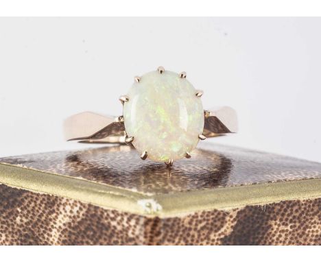 A 9ct gold circular opal ring, the white opal with claw setting on a tapered shank, ring size N1/2, opal 1ct approx, 3.9g