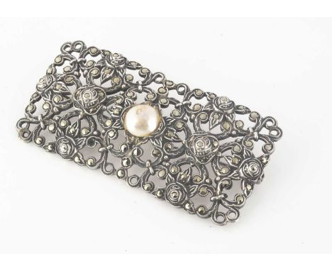 An Art Deco marcasite, silver and simulated panel brooch, of floral design, 5.8cm x 3cm, 16.6g