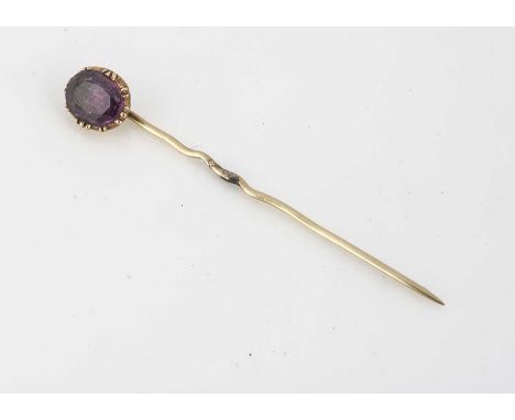 A ruby and gold set stick pin, the foil backed ruby within claw and rubbed over setting, ruby 6.9mm x 5.8mm, 1g