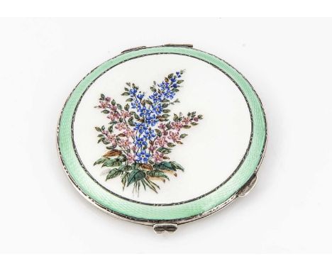 A silver and enamel compact, the circular green and white enamelled top decorated with a spray of blue and pink flowers, open