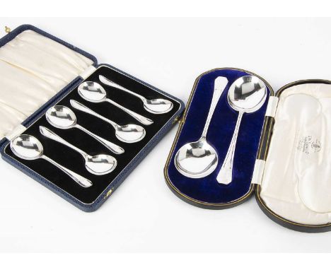 A cased pair of George V silver dessert servers by Henry Wilkinson, together with a cased set of six George V silver dessert 