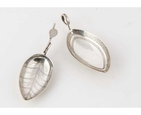Two George III period silver tea caddy spoons, each tea leaf shaped, 7.8cm and 8.1cm (2) BOTH APPEAR TO HAVE HAD REPAIRS TO T