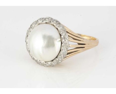 A continental yellow metal mabe pearl and diamond eight cut dress ring, the grey lustre pearl surrounded by a wreath of eight