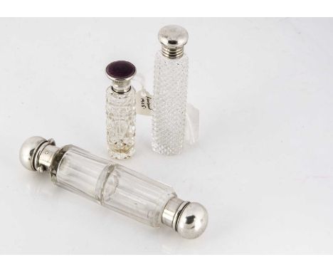 A Victorian cut glass double ended scent bottle, 14.5cm, one side with screw off cap, the other with hinged cap but not worki