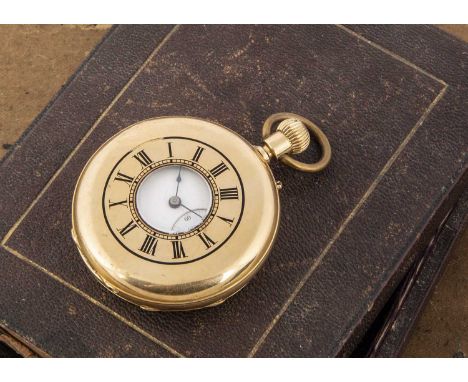A c1930s 18ct gold half hunter pocket watch, 48mm, 85.6g, appears to run, lacks some black enamel to front cover, marked 18k 