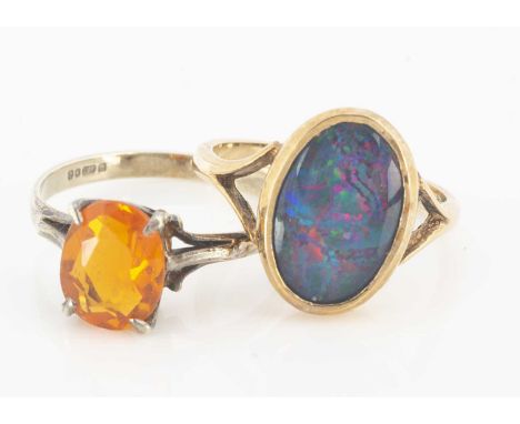 A 9ct gold fire opal single stone dress ring, in four claw setting, ring size O, opal 1.16ct, together with a 9ct gold black 