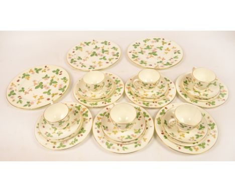 A Wedgwood "Wild Strawberry" tea service comprising six cups, six saucers, six side plates, six dinner plates and three sandw