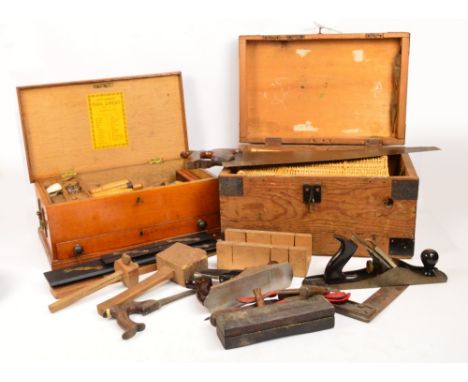An early 20th century oak small tool chest containing various chisels, a spoke shave, etc, a further rustic pine toolbox and 