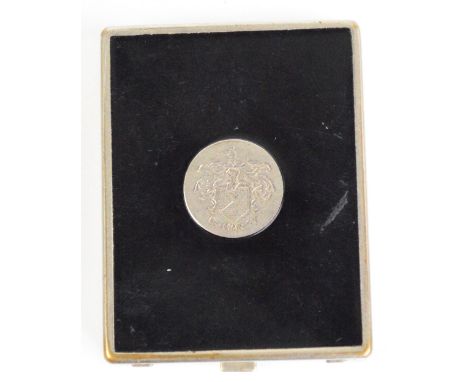 A Dubarry base metal compact of rectangular form, the interior inscribed "Dubarry London, made in USA", 6 x 4.5cm.