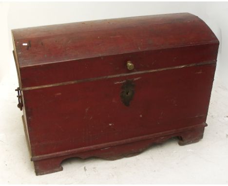 A large red painted domed trunk, width 71cm.
