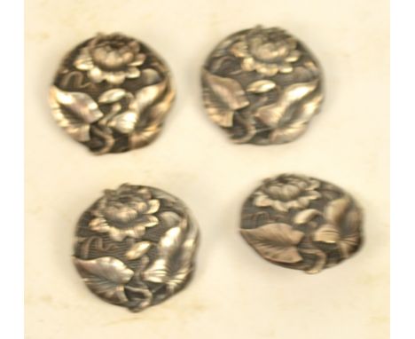 A set of four Edward VII hallmarked silver Art Nouveau circular buttons, each embossed with floral sprays, Chester 1906, diam