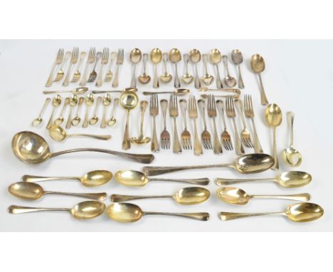 A George V hallmarked silver canteen of cutlery comprising a large soup ladle, a basting spoon, a pair of sauce ladles, a sif