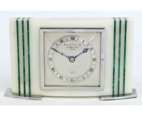 A Garrards onyx and malachite small mantel timepiece, the silvered chapter ring bearing Roman numerals and inscribed "Garrard