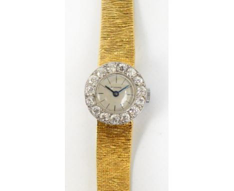 RECORD: a platinum cased lady's manual wind cocktail watch, the bezel set with fifteen brilliant cut diamonds each of approx 