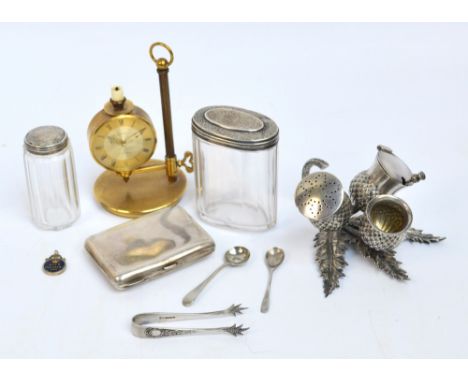 A mixed lot comprising a hallmarked silver cigarette case, Birmingham 1913, two silver topped glass jars, a plated three piec